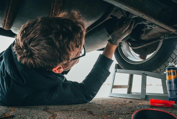 car mechanic conducting car maintenance servicing